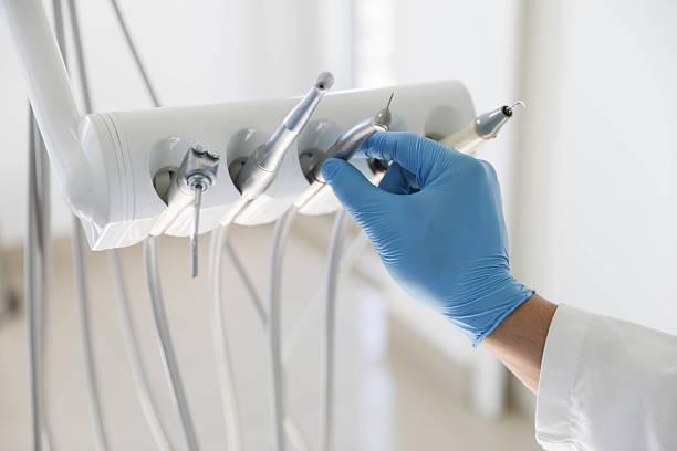 Professional Tooth Extraction technician working in Lansing, KS